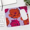 Custom neoprene mouse pad with vibrant red and pink flowers on a soft purple background, non-slip surface, and soft texture