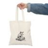 Personalized tote bag with a line drawing of a playful cat on a book, customizable with your cat's breed and name, made from eco-friendly cotton canvas.