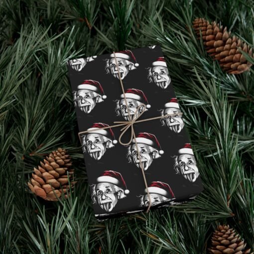 black gift wrap paper featuring Albert Einstein with his tongue out and wearing a Christmas hat, available in matte and satin finishes, perfect for wrapping gifts with a fun, intellectual twist