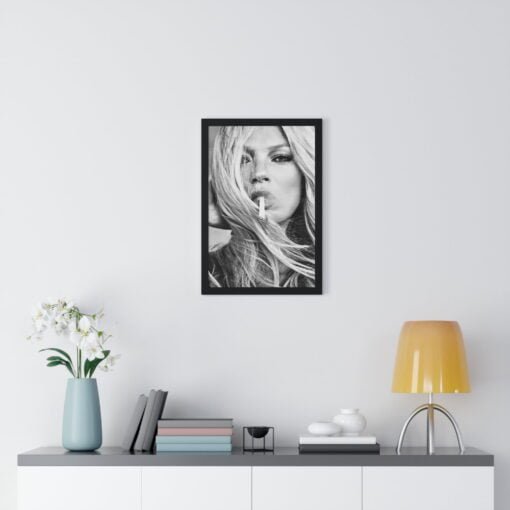 Elegant black and white framed poster of Kate Moss with a cigarette, showcasing her iconic style and timeless beauty, perfect for adding a touch of fashion-forward elegance.