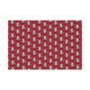 Red gift wrap paper featuring Albert Einstein with his tongue out and wearing a Christmas hat, available in matte and satin finishes, perfect for wrapping gifts with a fun, intellectual twist