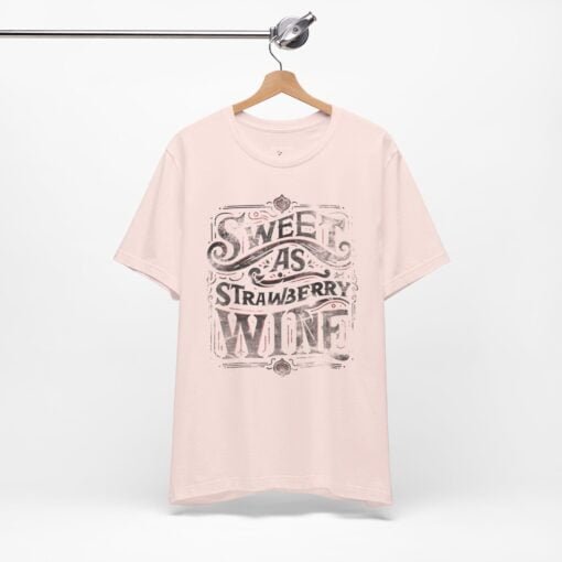 Feminine tee with 'Sweet as Strawberry Wine' in sketched typography and red accents, inspired by Chris Stapleton's music.