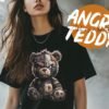 Streetwear T-shirt featuring an angry, stitched-up teddy bear with 'Cute as a Button' text, for a playful yet edgy look.